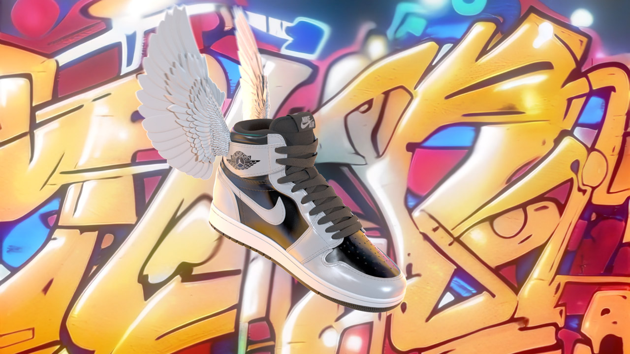Shoes with wings against abstract graffiti.